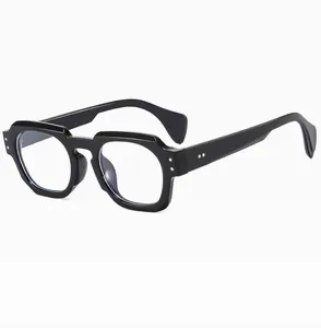 Close-up of retro square sunglasses with bold black frames and blue light lenses