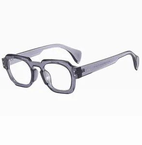 Macro view of translucent grey-purple polygon glasses frame with silver metal rivets