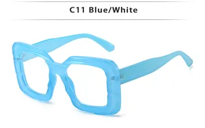 Detail view of bold square C11 blue translucent eyeglass frames with wide temples