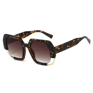Fashionable oversized tortoiseshell sunglasses with brown gradient lenses and gold trim