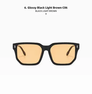 Détails de lunettes de soleil noires carrées avec rivets métalliques et verres marron