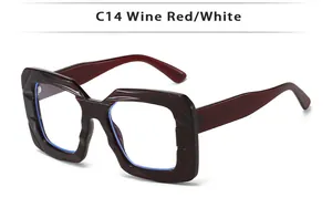 Close-up of wine red square frame with unique wavy textured edges and blue tint reflection