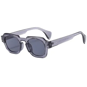 Modern grey translucent geometric sunglasses with a unique stepped frame design and dark lenses