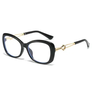 Lunettes de soleil œil de chat noires avec branches dorées courbes et protection UV