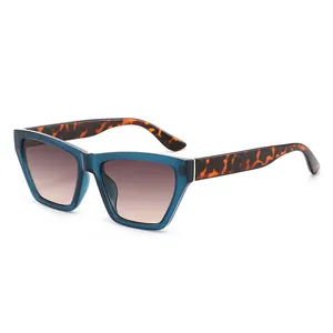 Retro cat-eye square sunglasses with blue transparent frames and tortoise temples