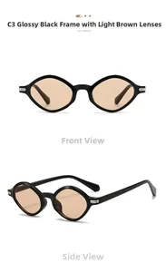 Detail view of oval black sunglasses with light brown lenses and metal hinge accents