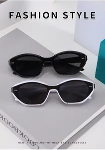 Close-up of cat-eye sunglasses with gold accents on black and white frames