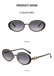 Detail of oval sunglasses with golden heart ornaments on the temples and gradient lenses