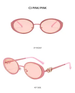 Pink oval sunglasses for women with elegant golden double heart decorative details