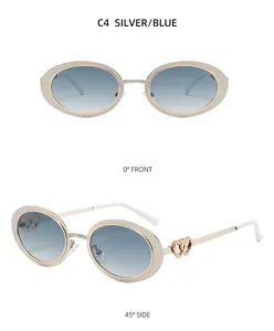 Oval silver sunglasses with blue gradient lenses and heart-shaped metal temples details