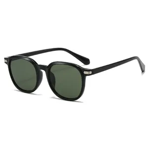 Classic black oval sunglasses with silver metal accents and dark green UV lenses