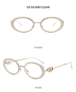 Detail view of oval silver metal frames featuring elegant double heart hollow decoration