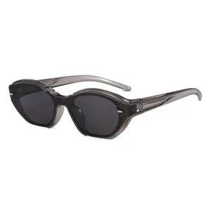 Fashionable cat-eye sunglasses with translucent gray frames and geometric cut lenses