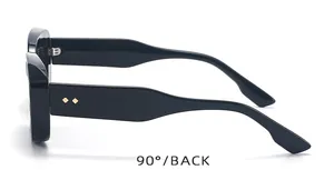 Detail view showing 90-degree side of black square sunglasses with golden diamond rivets