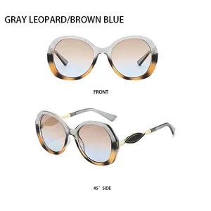 Detaillierte Vorder- und Seitenansicht der grau-leopard ovalen Sonnenbrille mit Blauverlauf