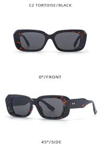 Detail view of tortoiseshell and black square frame sunglasses with metal rivets