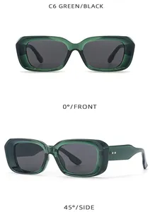 Detail view of green rectangular sunglasses with metal rivets and dark lenses