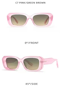 Detail of pink rectangular sunglasses with metal rivets and gradient brown lenses