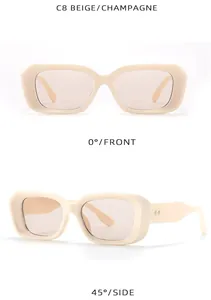 Detail view of beige square frame sunglasses featuring silver rivet accents and tinted lenses