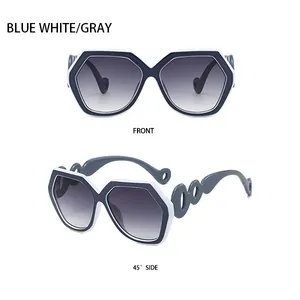 Detailed views of geometric oversized sunglasses in blue and white with grey gradient lenses