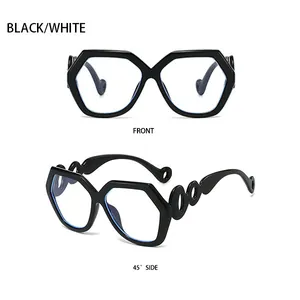 Detail view of black geometric oversized sunglasses with hollow rings on the temples