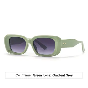 Sage green rectangular sunglasses with gradient grey lenses and golden rivet detail