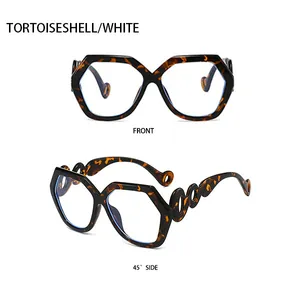 Detail view of tortoiseshell geometric sunglasses with hollowed wavy temple design