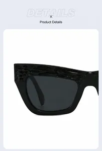 Vista macro de gafas de sol negras cat-eye con detalle de montura con textura ondulada 3D