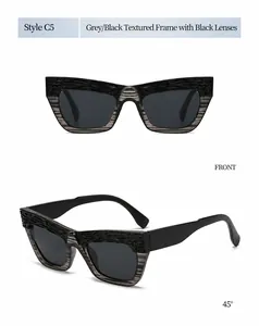 Detalle de gafas de sol de ojo de gato grandes con montura gris texturizada y lentes C5