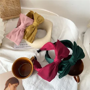 Elegant satin bow headbands in soft pink, yellow, burgundy and dark green colors