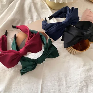 Elegant wide satin bow headbands in burgundy, green, navy, and black for women
