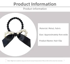 Détail d'élastique noir élégant avec nœud en perles blanches et ruban de soie
