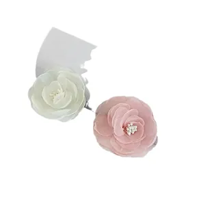 Pink and white camellia flower hair clips made of delicate chiffon fabric layers
