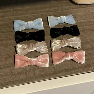 8-piece set of elegant velvet bow hair clips in blue, black, pink and champagne colors