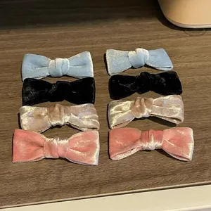Velvet bow hair clips set in blue, black, pink and champagne for elegant hairstyles