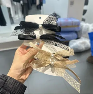 Eleganti fermagli per capelli con fiocco in pizzo nero e champagne e perle finte