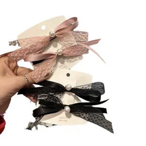 Set di fermagli per capelli con fiocco in pizzo e perle rosa e nere da donna