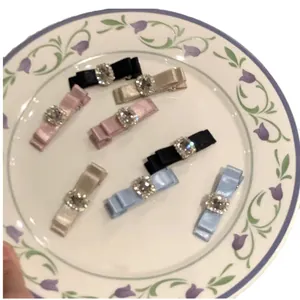 Elegant bow hair clips set with sparkling square rhinestones in assorted colors