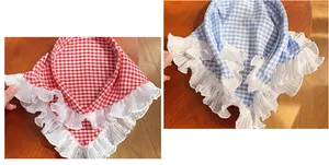 Detail of blue and red checkered bandanas with delicate white ruffled lace edges