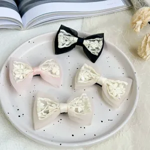 Elegant set of 4 French lace bow hair clips in black, pink, and cream white mesh