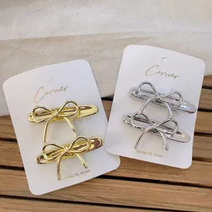 Minimalist metal bow hair clip set in gold and silver finish with elegant Korean style