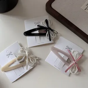 Three-piece set of elegant velvet bow hair clips with beads in black and cream