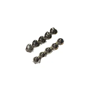 Silver metallic hair clips set featuring heart shapes and round beads on white background