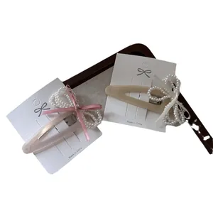 Vintage velvet bow beaded hair clips with pearls on elegant display card