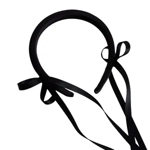 Elegant black ribbon bow headband with long silk streamers for ballet style hairstyle