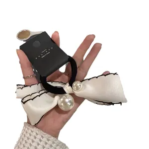 Elegant pearl bow scrunchie with cream satin ribbon and high elastic band for women