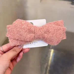 Pink woolen bow hair clip with spring fastener, minimalist Korean style fashion accessory