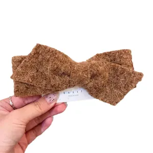 Brown wool bow hair clip with plush texture and elegant design for autumn and winter
