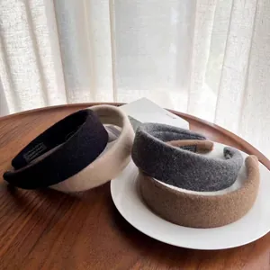 Elegant thick wool felt headbands in four earthy colors with a handmade label