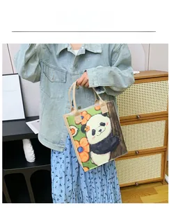Artistic panda and floral canvas tote bag shown with a model in a home setting